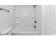 Bathroom with shower-tub combo, white walls, and modern fixtures creates a clean and functional space at 4532 Spyglass Dr., Little River, SC 29566