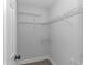 Organize effortlessly in this walk-in closet with multiple levels of shelving for optimal storage at 4532 Spyglass Dr., Little River, SC 29566