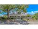 Clubhouse featuring a metal roof, inviting front porch, and beautiful landscaping for community gatherings at 4532 Spyglass Dr., Little River, SC 29566