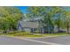 Charming blue home with an attached garage and a well-manicured lawn at 4532 Spyglass Dr., Little River, SC 29566