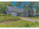Attractive home with tidy landscaping, attached garage, and mature trees at 4532 Spyglass Dr., Little River, SC 29566