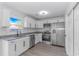 Modern kitchen with stainless steel appliances, granite countertops, and sleek cabinetry at 4532 Spyglass Dr., Little River, SC 29566