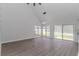 Bright and airy living room with wood floors, vaulted ceilings and many windows at 4532 Spyglass Dr., Little River, SC 29566