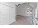 Spacious living area with wood floors, access to the kitchen and a closet at 4532 Spyglass Dr., Little River, SC 29566