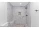 This renovated tiled shower features a built-in bench and mosaic-tile floor and niche at 4532 Spyglass Dr., Little River, SC 29566