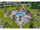 Scenic aerial shot of the community pool, lush green spaces and tropical trees at 4655 Wild Iris Dr. # 41-303, Myrtle Beach, SC 29577
