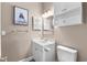 Cozy half-bathroom with a pedestal sink, toilet, framed mirror, and decorative artwork at 4655 Wild Iris Dr. # 41-303, Myrtle Beach, SC 29577