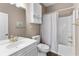 Bright bathroom with a single vanity, toilet, and shower-tub combo with white tile surround and modern fixtures at 4655 Wild Iris Dr. # 41-303, Myrtle Beach, SC 29577