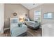 Stylish bedroom featuring two twin beds, neutral walls, bright window and tasteful decor at 4655 Wild Iris Dr. # 41-303, Myrtle Beach, SC 29577