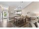 Inviting dining area offering a view of the kitchen, a table set for six, and views out the front door at 4655 Wild Iris Dr. # 41-303, Myrtle Beach, SC 29577