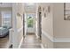 Hallway leading to the front door and features a laundry area and view of a cozy bedroom at 4655 Wild Iris Dr. # 41-303, Myrtle Beach, SC 29577