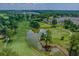 Scenic golf course view with lush green fairways, mature trees, and a tranquil pond at 4655 Wild Iris Dr. # 41-303, Myrtle Beach, SC 29577