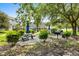 Outdoor grilling area with picnic tables surrounded by trees and views of the community at 4655 Wild Iris Dr. # 41-303, Myrtle Beach, SC 29577