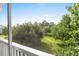 Serene community view from the screened porch, showcasing lush greenery and blue sky at 4655 Wild Iris Dr. # 41-303, Myrtle Beach, SC 29577