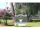 Magnolia Place community sign amid manicured landscaping and blooming trees at 4655 Wild Iris Dr. # 41-303, Myrtle Beach, SC 29577