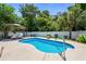 Inviting backyard with a sparkling pool, lounge chairs, and lush landscaping at 5 Ruth St., Murrells Inlet, SC 29576