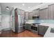 Modern kitchen with stainless steel appliances, including a refrigerator and a gas range at 5 Ruth St., Murrells Inlet, SC 29576