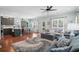 Open-concept living room with hardwood floors, a cozy sofa and a ceiling fan at 5 Ruth St., Murrells Inlet, SC 29576
