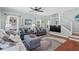 Inviting living room featuring hardwood floors, neutral walls, and a modern staircase at 5 Ruth St., Murrells Inlet, SC 29576