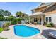 Beautiful backyard pool area with covered patio and seating, ideal for entertaining at 5 Ruth St., Murrells Inlet, SC 29576