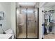 Modern tile shower with glass enclosure and walk-in closet at 5 Ruth St., Murrells Inlet, SC 29576