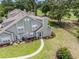 Aerial view of townhomes with backyard patios and landscaping, situated next to a golf course at 503 N 20Th Ave. N # 41D, North Myrtle Beach, SC 29582