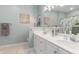 Well lit bathroom featuring double sinks, decorative mirror, and coastal-themed decor at 503 N 20Th Ave. N # 41D, North Myrtle Beach, SC 29582