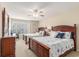 Bright bedroom with two beds featuring nautical themed bedding, ceiling fan, and lots of dresser storage at 503 N 20Th Ave. N # 41D, North Myrtle Beach, SC 29582