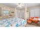 Bedroom featuring a four-poster bed, dresser, ceiling fan, and a comfortable papasan chair at 503 N 20Th Ave. N # 41D, North Myrtle Beach, SC 29582