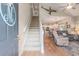 Inviting entryway with staircase, hardwood floors, and open view to the living room and kitchen at 503 N 20Th Ave. N # 41D, North Myrtle Beach, SC 29582