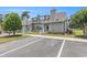 Charming condo with gray siding, manicured lawn, and convenient parking space at 503 N 20Th Ave. N # 41D, North Myrtle Beach, SC 29582