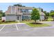 Lovely condo featuring well-maintained landscaping, gray siding, and easy parking at 503 N 20Th Ave. N # 41D, North Myrtle Beach, SC 29582
