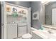 A laundry room area featuring a washer and dryer, shelving, and a sink and toilet at 503 N 20Th Ave. N # 41D, North Myrtle Beach, SC 29582