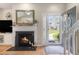 Comfortable living room with a fireplace, and a view of the home's exterior through the open door at 503 N 20Th Ave. N # 41D, North Myrtle Beach, SC 29582