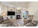 Cozy living room featuring a fireplace, hardwood floors, and a staircase leading upstairs at 503 N 20Th Ave. N # 41D, North Myrtle Beach, SC 29582