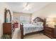Spacious bedroom with an ornate wood bed frame, side tables and a dresser at 503 N 20Th Ave. N # 41D, North Myrtle Beach, SC 29582