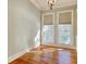 Bright bedroom with hardwood floors, two windows and neutral paint at 55 Pineberry Dr., Georgetown, SC 29440