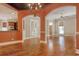 Elegant dining room with a decorative chandelier, tin ceilings, and hardwood floors at 55 Pineberry Dr., Georgetown, SC 29440
