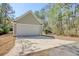 Spacious two car garage and long driveway surrounded by trees, offering ample parking and curb appeal at 55 Pineberry Dr., Georgetown, SC 29440