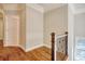 Hallway landing with hardwood floors, nice banister and an open doorway at 55 Pineberry Dr., Georgetown, SC 29440