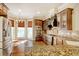 Gourmet kitchen featuring granite countertops, stainless steel appliances, and a breakfast nook at 55 Pineberry Dr., Georgetown, SC 29440