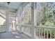 Picturesque screened-in porch, showcasing the perfect spot to enjoy nature and relax in comfort and style at 55 Pineberry Dr., Georgetown, SC 29440
