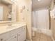Bright bathroom featuring a vanity with storage and a shower-tub combination at 5505 N Ocean Blvd. # 303, Myrtle Beach, SC 29577