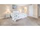 Serene bedroom featuring a beach-themed bedspread, bedside table, and soft lighting at 5505 N Ocean Blvd. # 303, Myrtle Beach, SC 29577