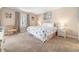 Comfortable bedroom with a beach-themed bedspread, plenty of natural light and a relaxing chair at 5505 N Ocean Blvd. # 303, Myrtle Beach, SC 29577