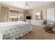 Spacious bedroom with balcony access, dresser, TV and seating at 5505 N Ocean Blvd. # 303, Myrtle Beach, SC 29577