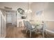 Cozy dining area features a glass table with seating for four and stylish decor at 5505 N Ocean Blvd. # 303, Myrtle Beach, SC 29577
