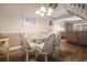 Dining room with seating for six guests, adjacent to living room and stairway at 5505 N Ocean Blvd. # 303, Myrtle Beach, SC 29577