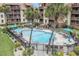 Beautiful pool area with lounge chairs, palm trees, and well-maintained landscaping at 5505 N Ocean Blvd. # 303, Myrtle Beach, SC 29577