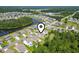 Aerial view featuring a well-planned residential area, nearby pond, and mature trees surrounding neighborhood at 597 Heritage Downs Dr., Conway, SC 29526
